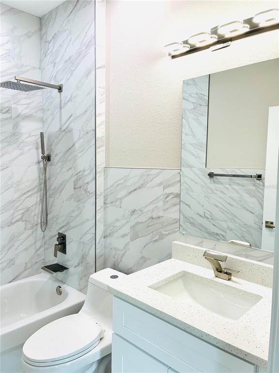 98 Wheatfield Drive, Unit B Palm Coast, FL 32164 - Photo 11 of 21 a bathroom with a sink toilet and shower