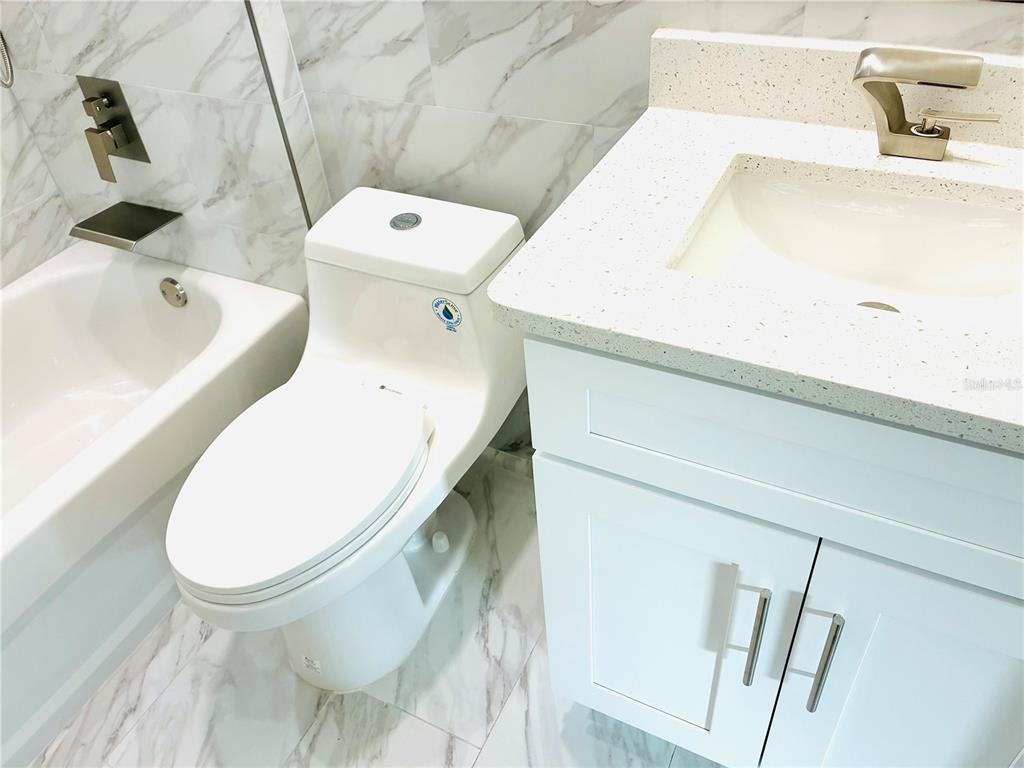 98 Wheatfield Drive, Unit B Palm Coast, FL 32164 - Photo 14 of 21 a bathroom with a sink and toilet