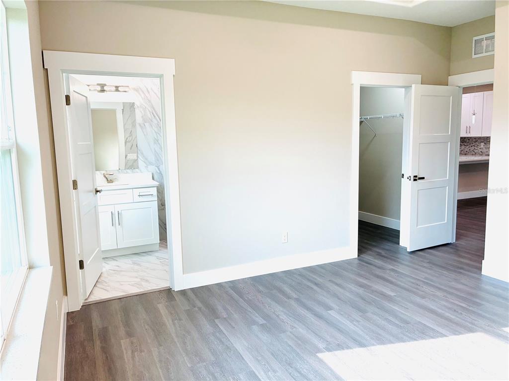 98 Wheatfield Drive, Unit B Palm Coast, FL 32164 - Photo 16 of 21 wooden floor in an empty room