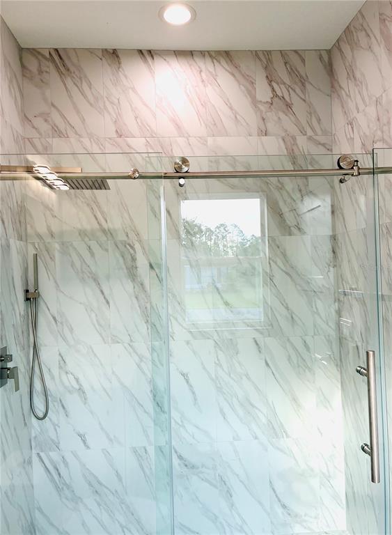 98 Wheatfield Drive, Unit B Palm Coast, FL 32164 - Photo 18 of 21 a bathroom with a shower