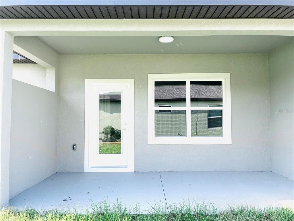 98 Wheatfield Drive, Unit B Palm Coast, FL 32164 - Photo 21 of 21 a view of an empty room with a window