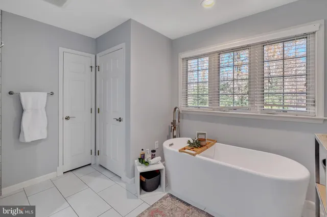 a bedroom with a bed and a night stand