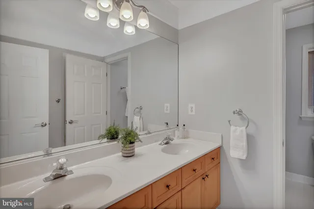 a view of a livingroom with furniture and a book shelf