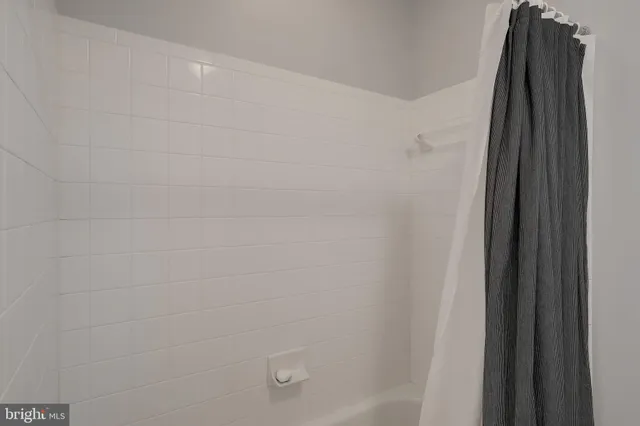 a bathroom with a toilet a sink and a mirror