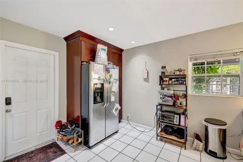 a view of room with window and furniture