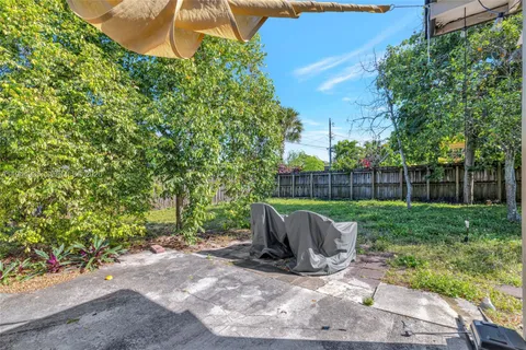 a view of backyard with seating space