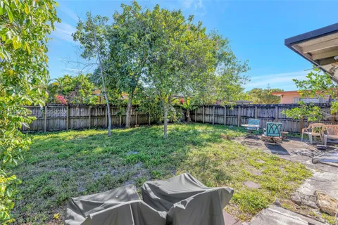 a backyard of a house with lots of green space