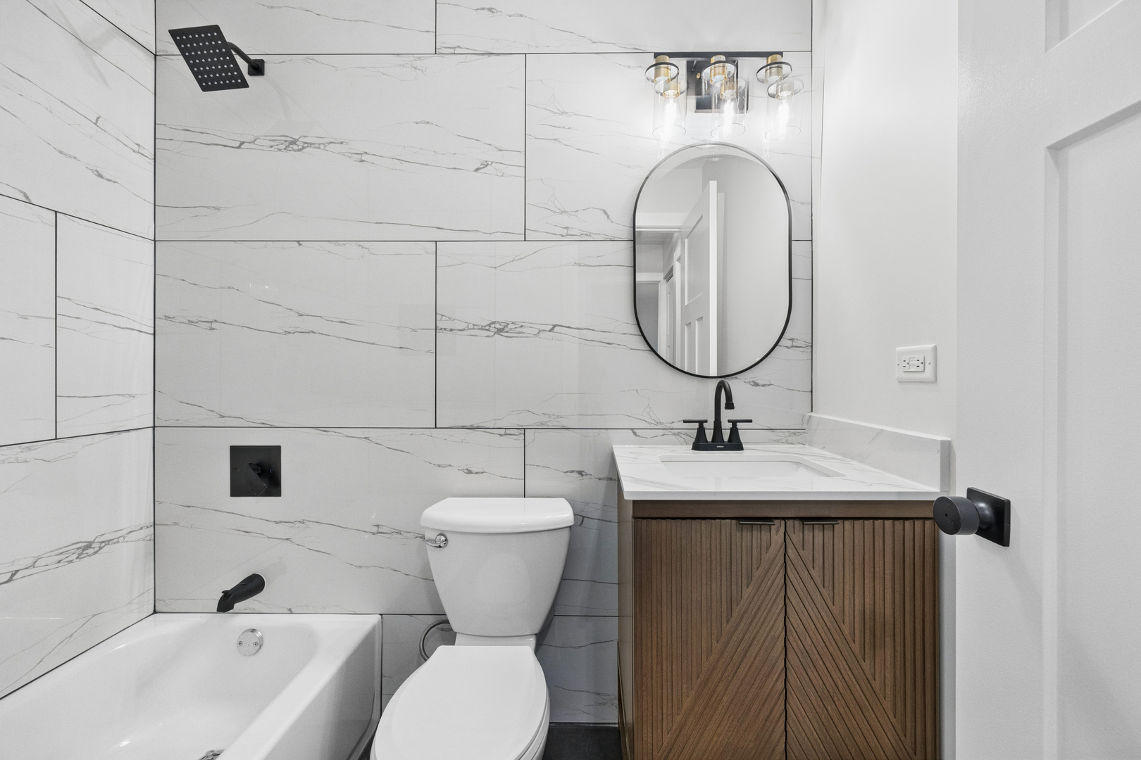 570 Andover Street Chicago Heights, IL 60411 - Photo 20 of 22 a bathroom with a toilet sink and mirror