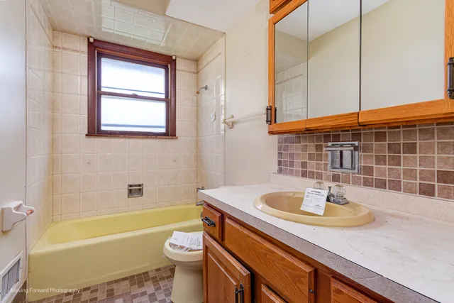 a bathroom with a sink a bathtub and a toilet