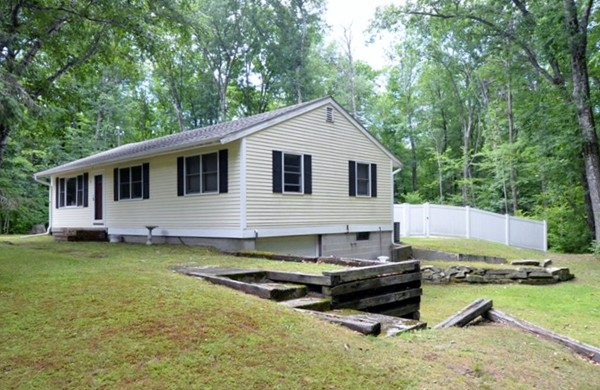 50 Beaman Road Sterling, MA 01564 - Photo 11 of 13 a backyard of a house with barbeque oven and trees