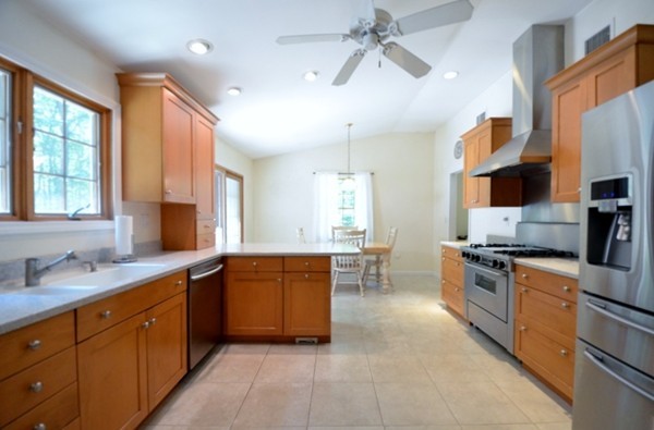 50 Beaman Road Sterling, MA 01564 - Photo 4 of 13 a large kitchen with stainless steel appliances granite countertop a lot of counter space and a sink