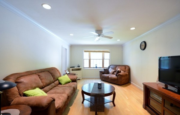 50 Beaman Road Sterling, MA 01564 - Photo 7 of 13 a living room with furniture a chandelier and a flat screen tv