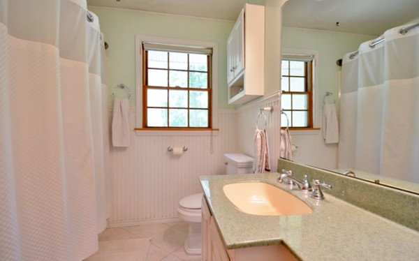 50 Beaman Road Sterling, MA 01564 - Photo 10 of 13 a bathroom with a granite countertop sink and a mirror