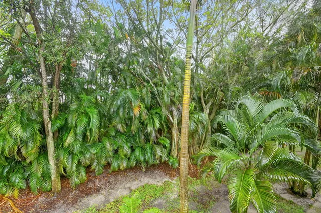 a swimming pool with outdoor seating and yard