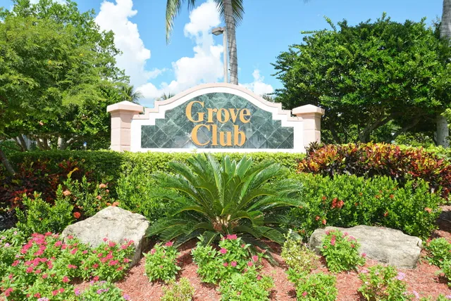 a backyard of a house with lots of green space and fountain