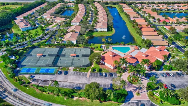 an aerial view of residential building and lake