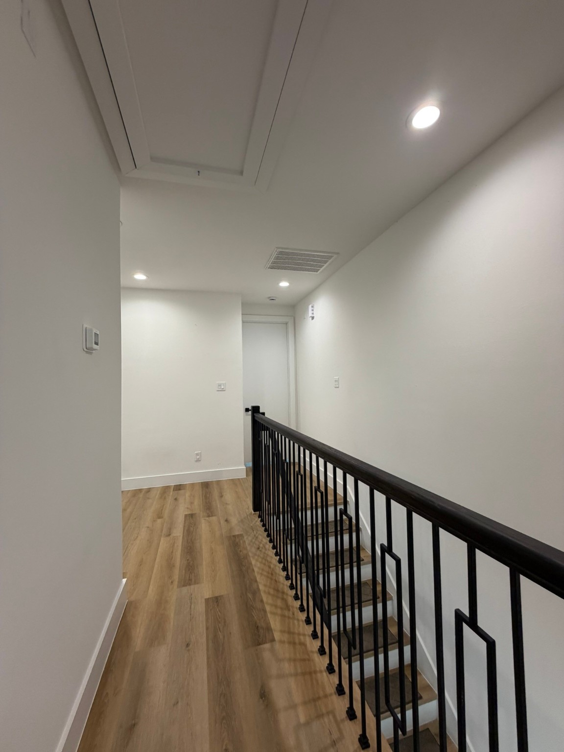 6733 Peerless Street Houston, TX 77021 - Photo 15 of 22 a view of hallway with wooden floor