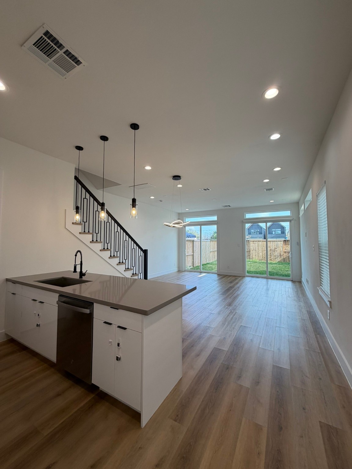 6733 Peerless Street Houston, TX 77021 - Photo 3 of 22 a kitchen with granite countertop a stove and wooden floor