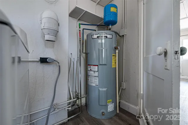 a view of a room with wooden floor and windows