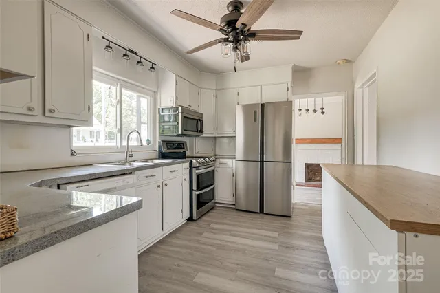 a kitchen with a refrigerator a sink and dishwasher