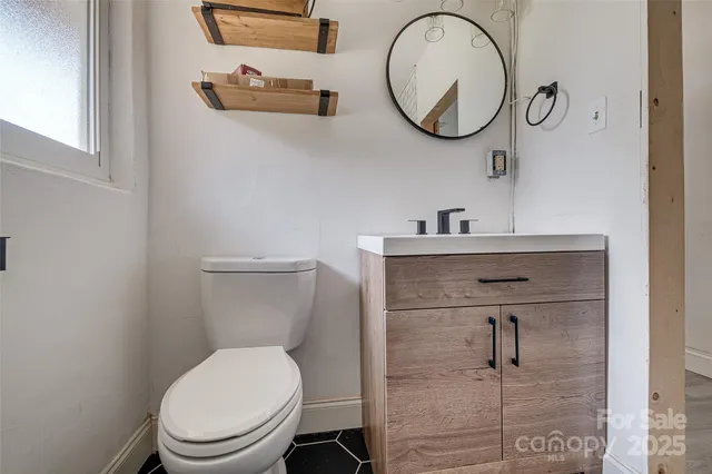 a view of a house with a backyard and a patio