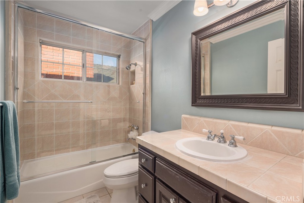 2201 Agnes Road Manhattan Beach, CA 90266 - Photo 14 of 36 a bathroom with a sink and a mirror