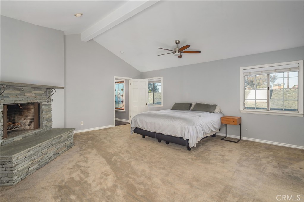 2201 Agnes Road Manhattan Beach, CA 90266 - Photo 24 of 36 a spacious bedroom with a bed and a fireplace