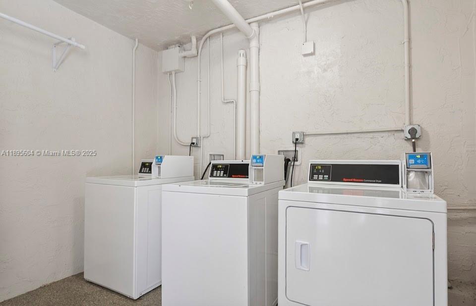 14140 Southwest 84th Street, Unit 104H Miami, FL 33183 - Photo 11 of 13 a utility room with dryer and washer
