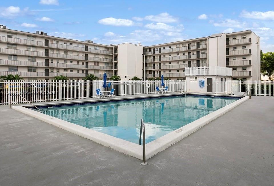 14140 Southwest 84th Street, Unit 104H Miami, FL 33183 - Photo 12 of 13 a view of swimming pool with a balcony