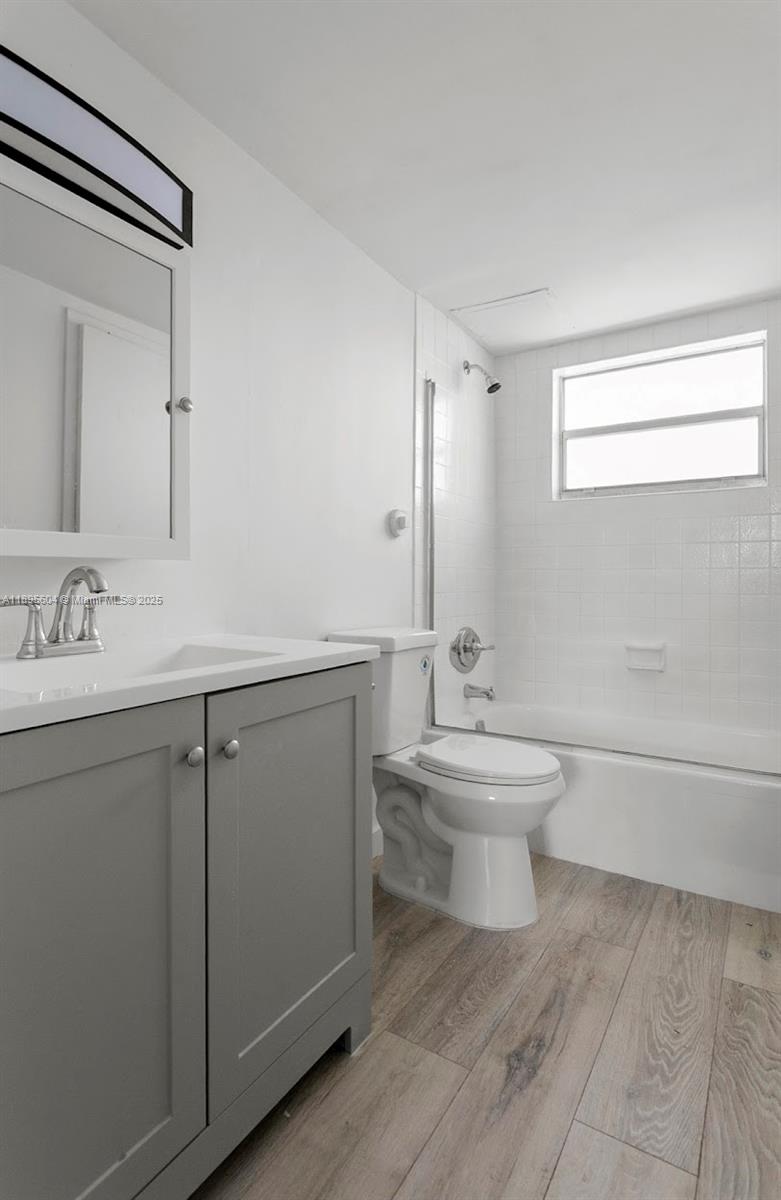 14140 Southwest 84th Street, Unit 104H Miami, FL 33183 - Photo 13 of 13 a bathroom with a sink toilet and a mirror