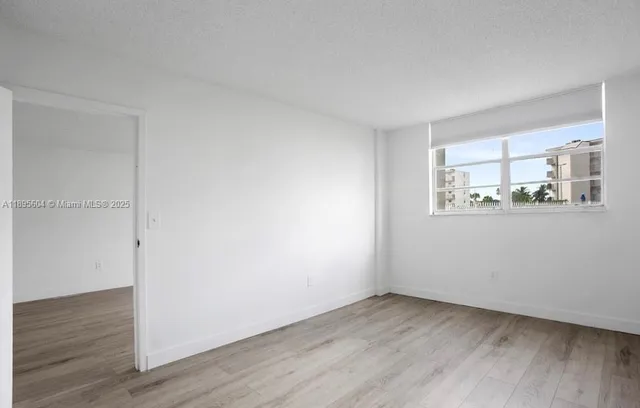 a view of a room that has a window in it