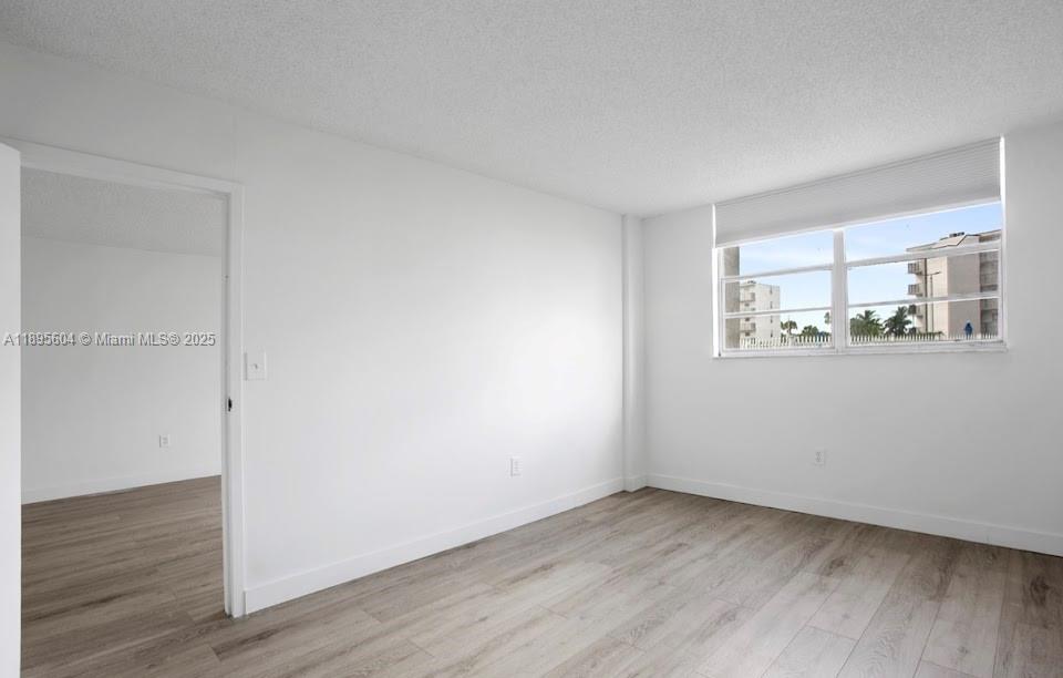 14140 Southwest 84th Street, Unit 104H Miami, FL 33183 - Photo 8 of 13 a view of a room that has a window in it