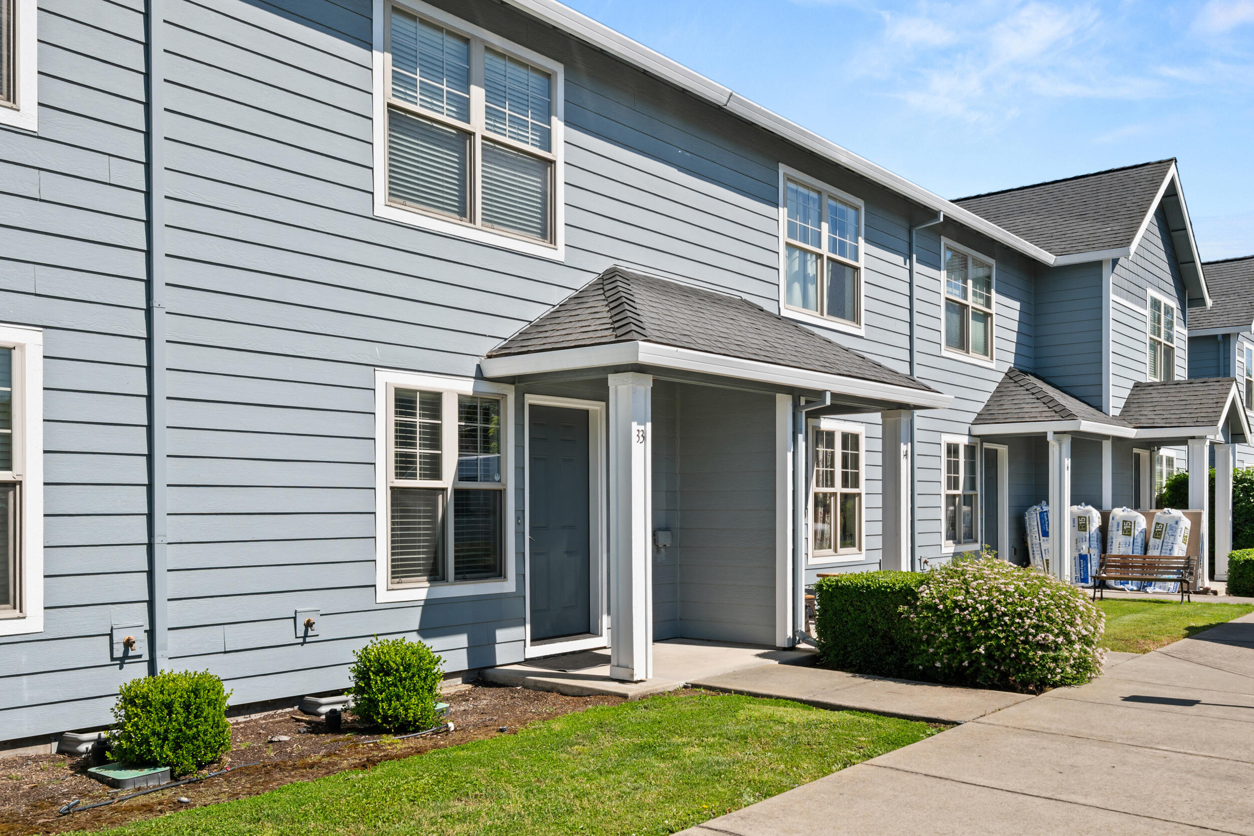 450 Midway Road, Unit 33 Medford, OR 97501 - Photo 2 of 21 a front view of a house with a yard