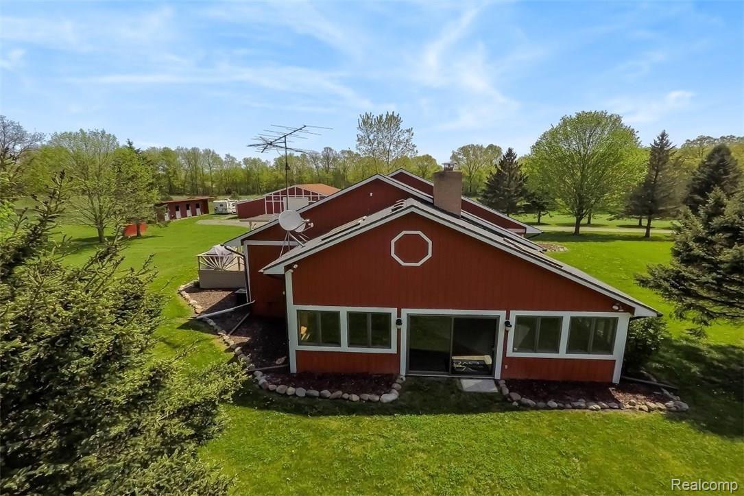6415 Hogan Road Fenton, MI 48430 - Photo 66 of 72 Hot tub rec room off the living room and kitchen has access to the side yard