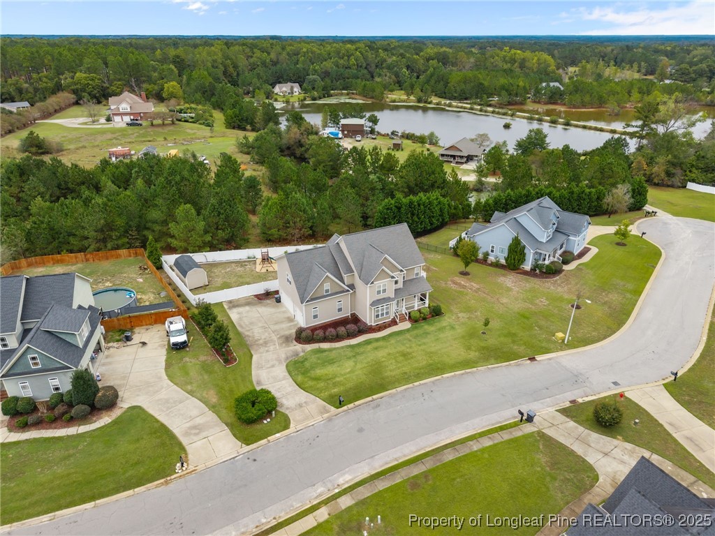 335 Lancelot Court Linden, NC 28356 - Photo 11 of 50 an aerial view of residential houses with outdoor space and pool