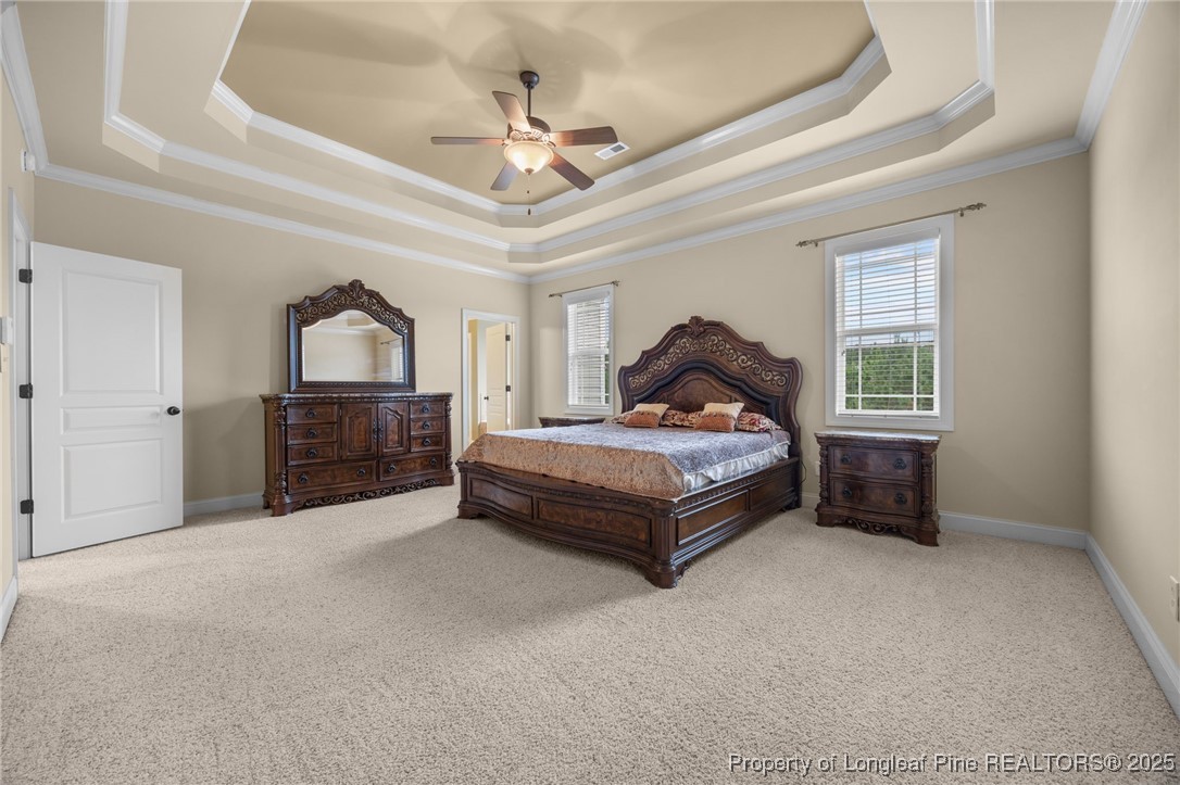 335 Lancelot Court Linden, NC 28356 - Photo 13 of 50 a bedroom with a bed dresser and a window