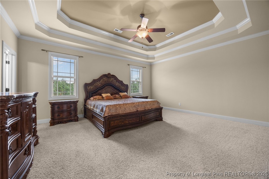 335 Lancelot Court Linden, NC 28356 - Photo 14 of 50 a bedroom with a bed and a ceiling fan