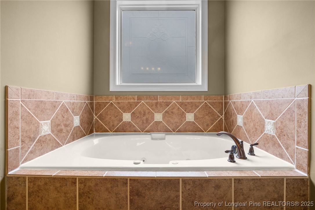 335 Lancelot Court Linden, NC 28356 - Photo 18 of 50 a bathroom with a bathtub