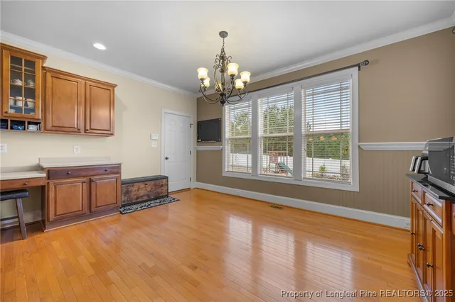 a view of a livingroom with a window and furniture