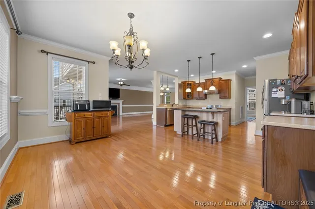 a large kitchen with a table and chairs