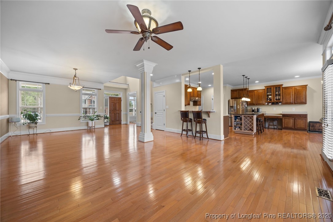 335 Lancelot Court Linden, NC 28356 - Photo 42 of 50 a view of a dining hall with a large window with wooden floor