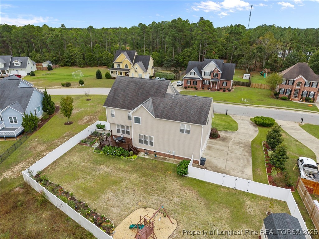 335 Lancelot Court Linden, NC 28356 - Photo 49 of 50 a view of a swimming pool with a garden