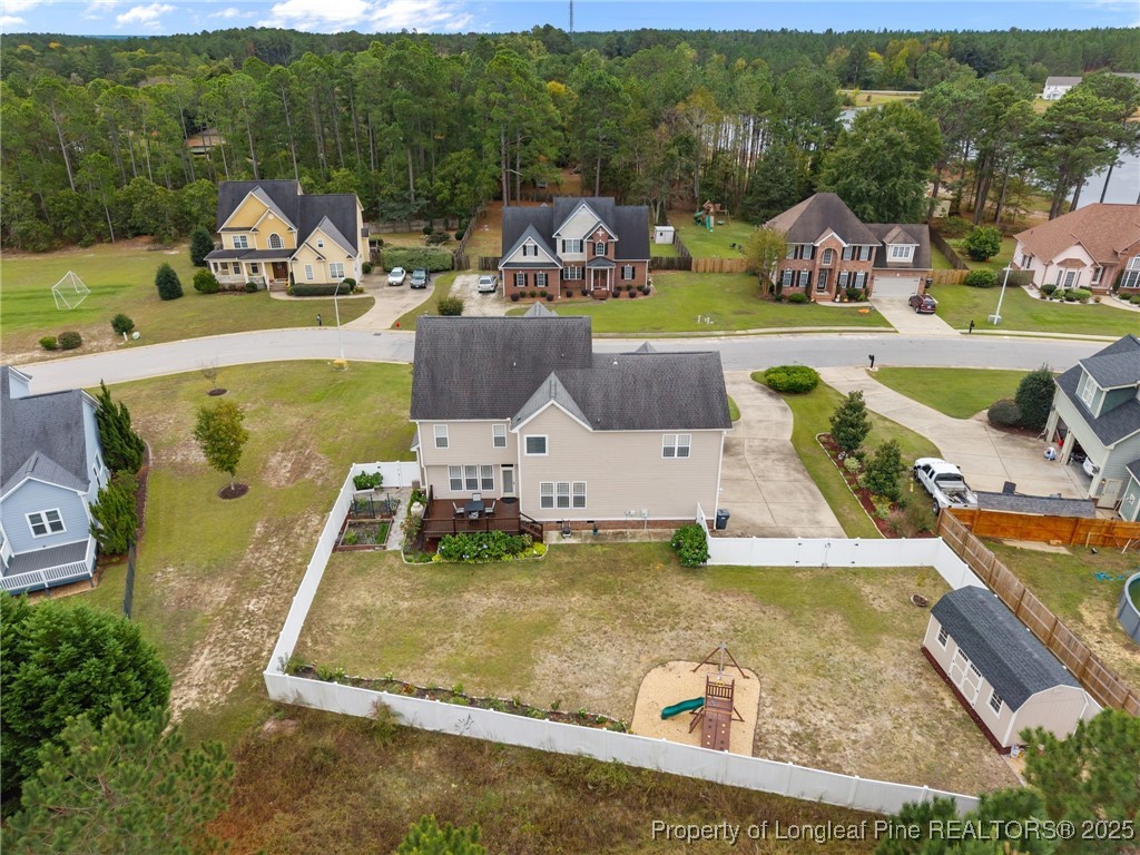 335 Lancelot Court Linden, NC 28356 - Photo 8 of 50 an aerial view of a house with swimming pool patio and lake view