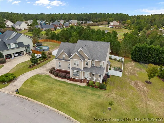 an aerial view of a house with a garden