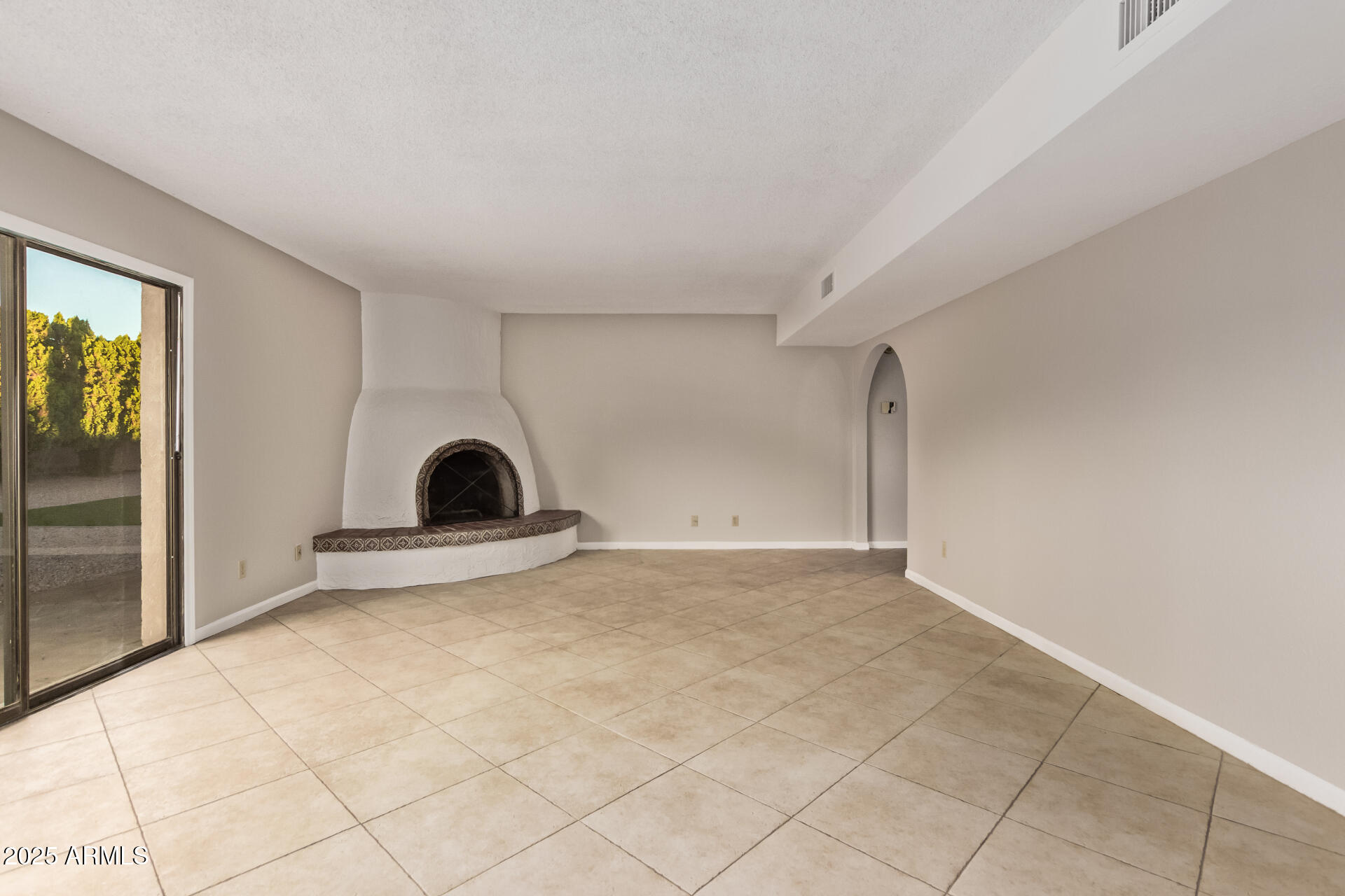 4912 East Ludlow Drive Scottsdale, AZ 85254 - Photo 11 of 36 a view of empty room with a fireplace