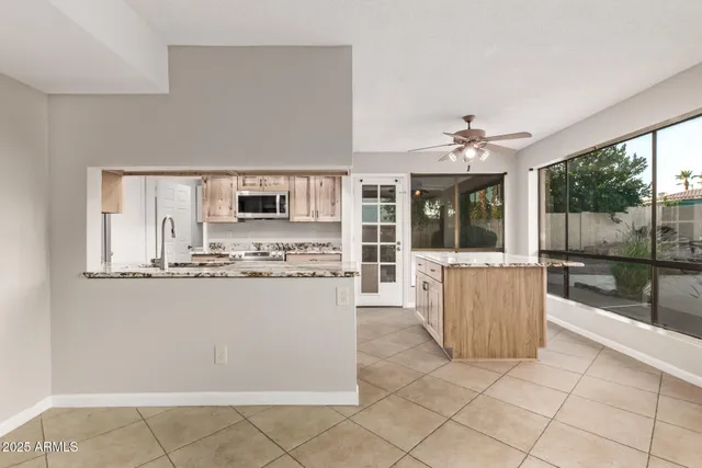 a view of empty room with a fireplace