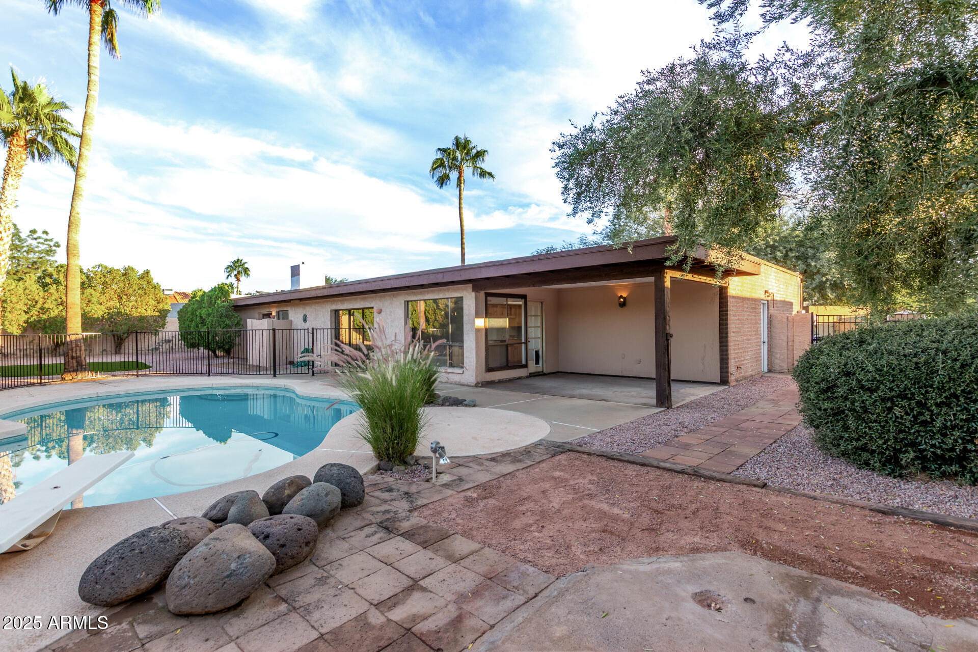 4912 East Ludlow Drive Scottsdale, AZ 85254 - Photo 32 of 36 a front view of a house with garden