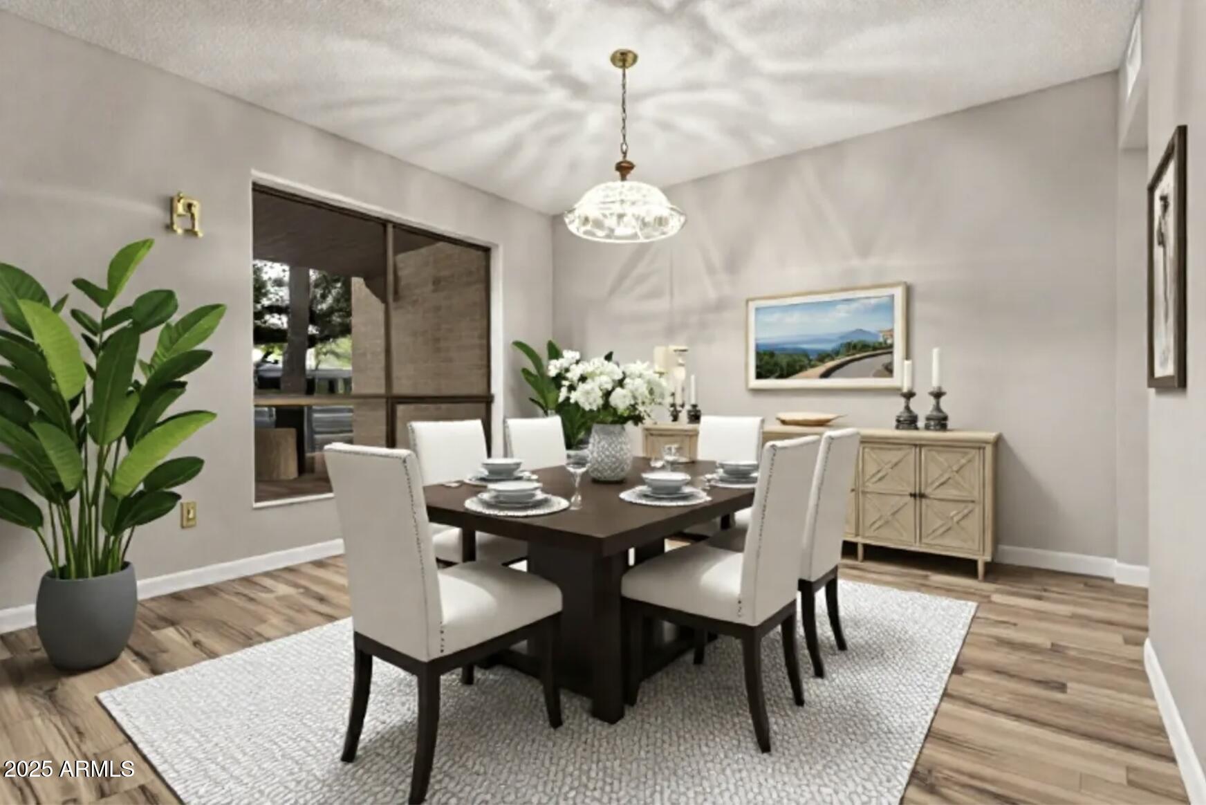 4912 East Ludlow Drive Scottsdale, AZ 85254 - Photo 7 of 36 a dining room with furniture potted plants and wooden floor