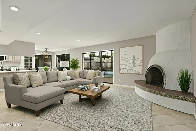 a dining room with furniture potted plants and wooden floor