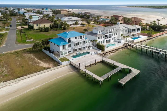 an aerial view of a house with a ocean view